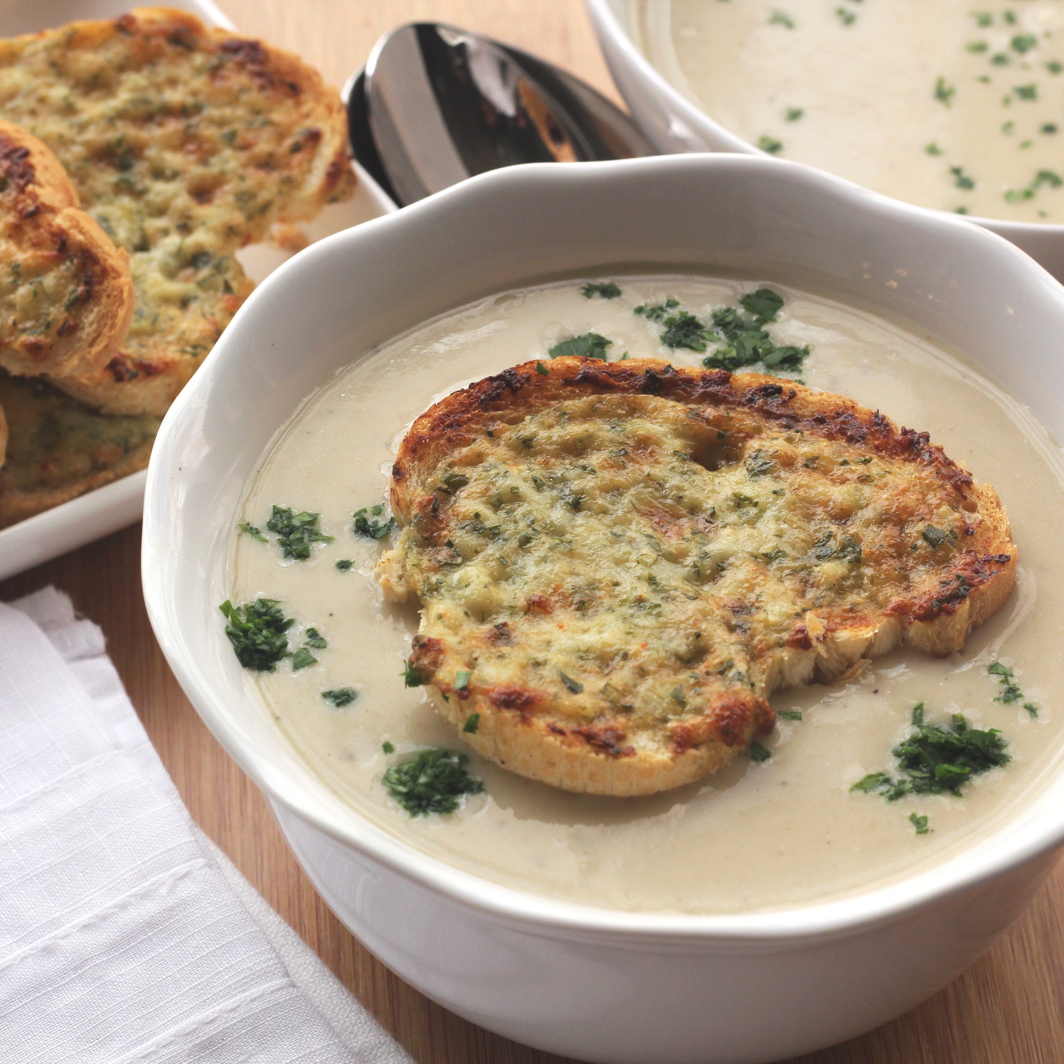 Caramelized Onion and Parmesan Cheese Soup with Parmesan Cheese Toasts | Emerils.com