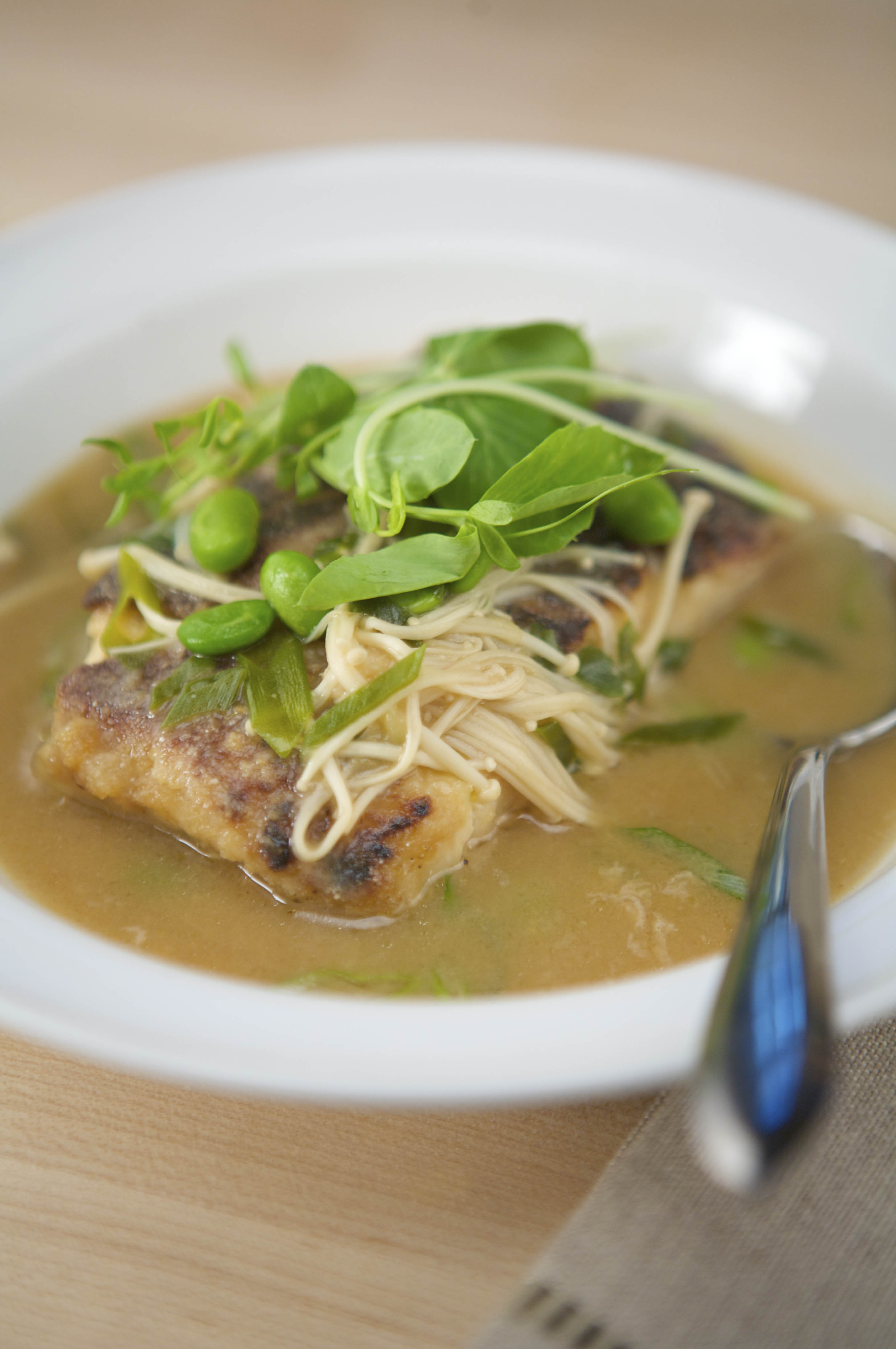 Panseared Halibut In A Miso Broth With Enoki Mushrooms, Edamame, And