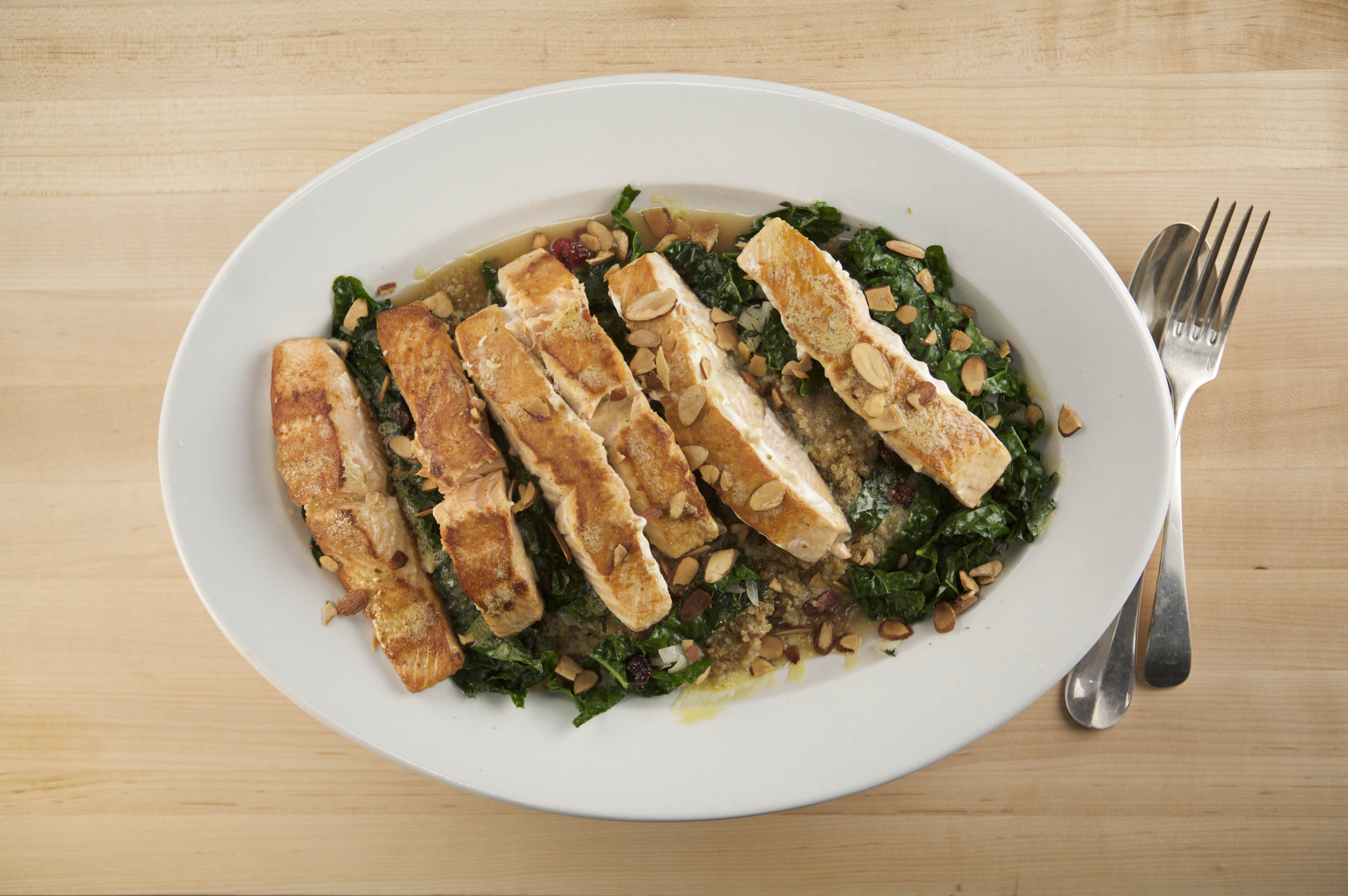 Salmon With Quinoa Mix, Sautéed Kale And Lemon Dijon Vinaigrette
