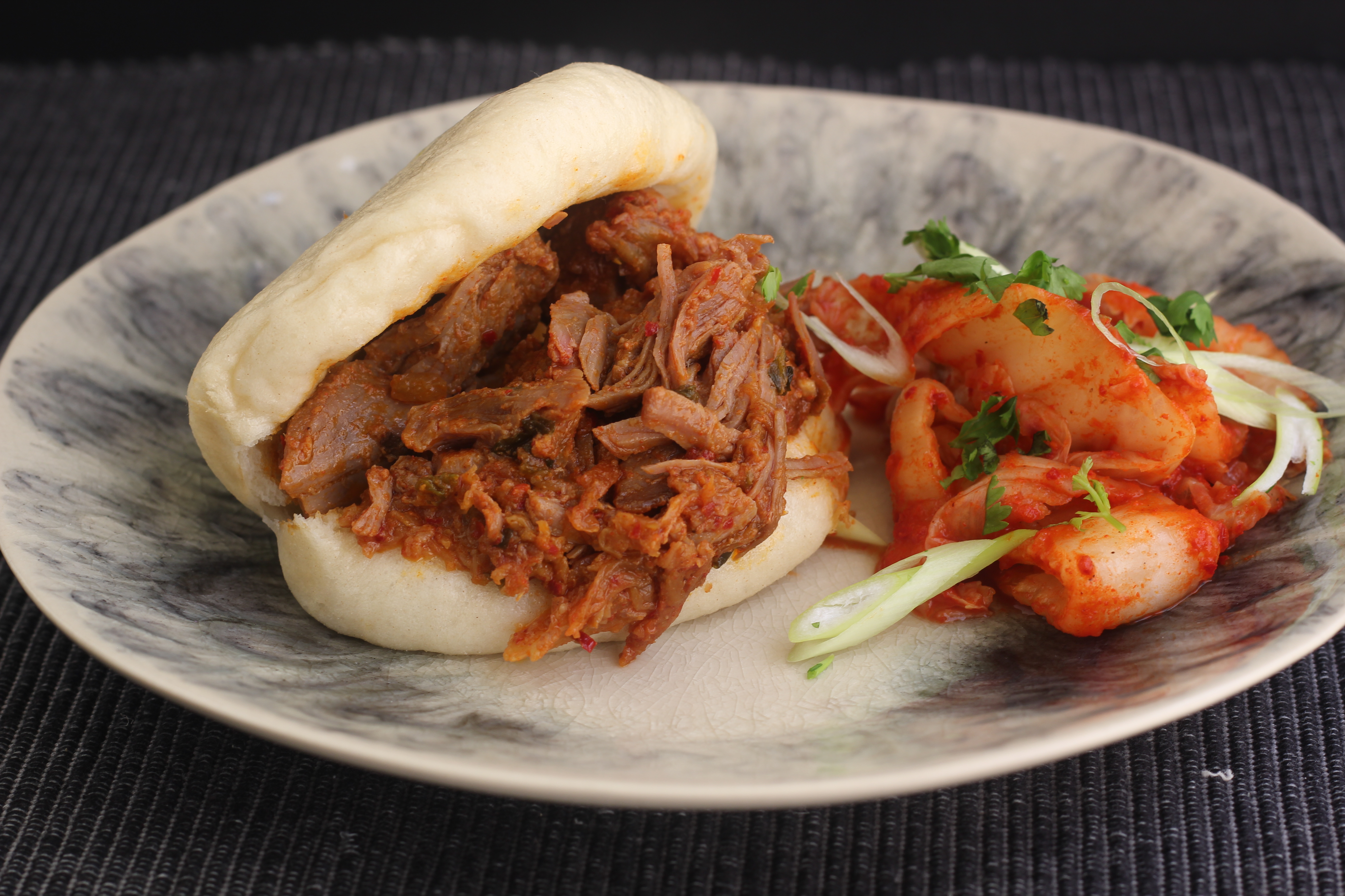 STEAMED BUNS WITH KIMCHI BRAISED PORK | Emerils.com