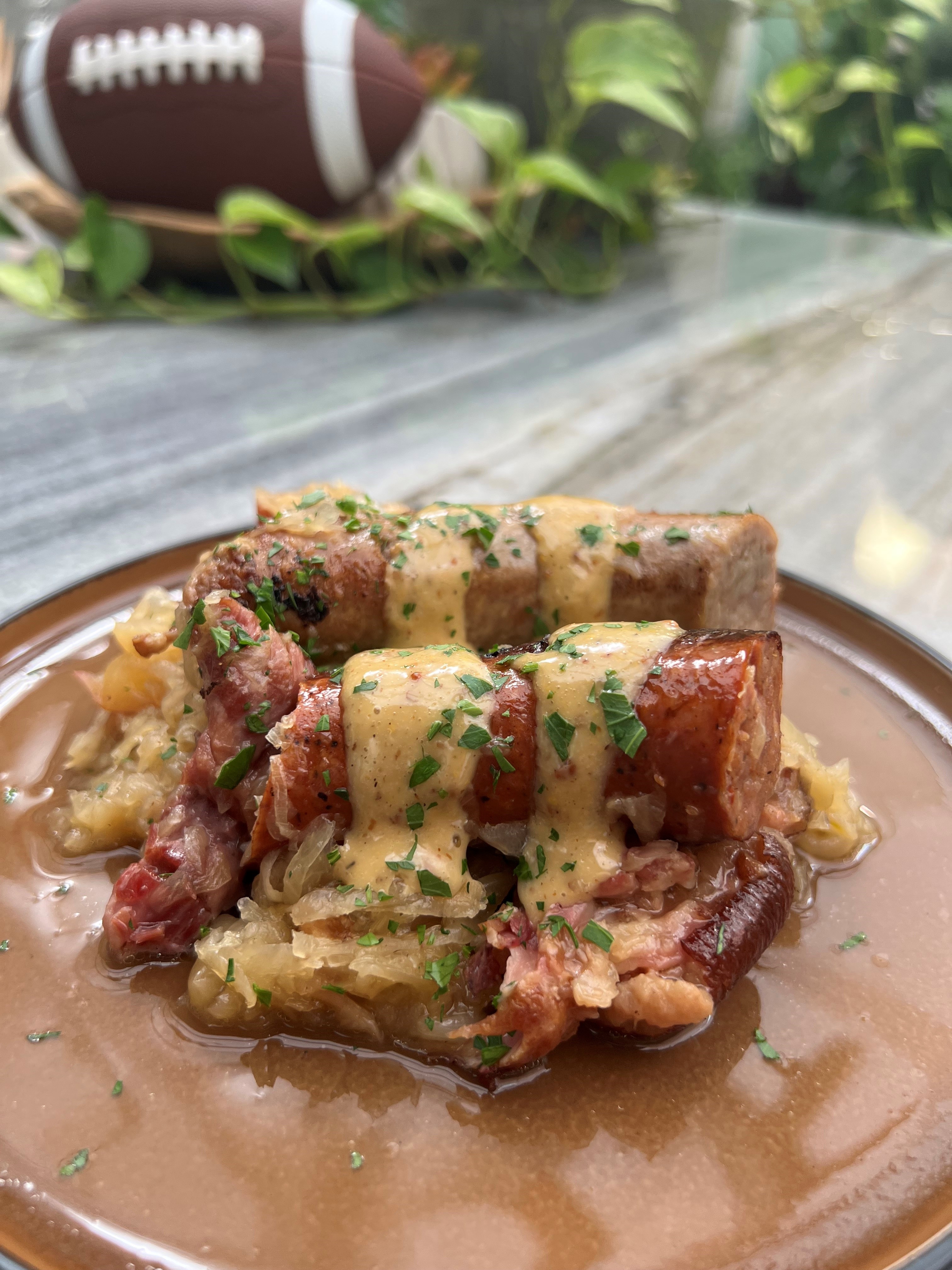 Beer Braised Sausages and Cabbage for a Crowd | Emerils.com