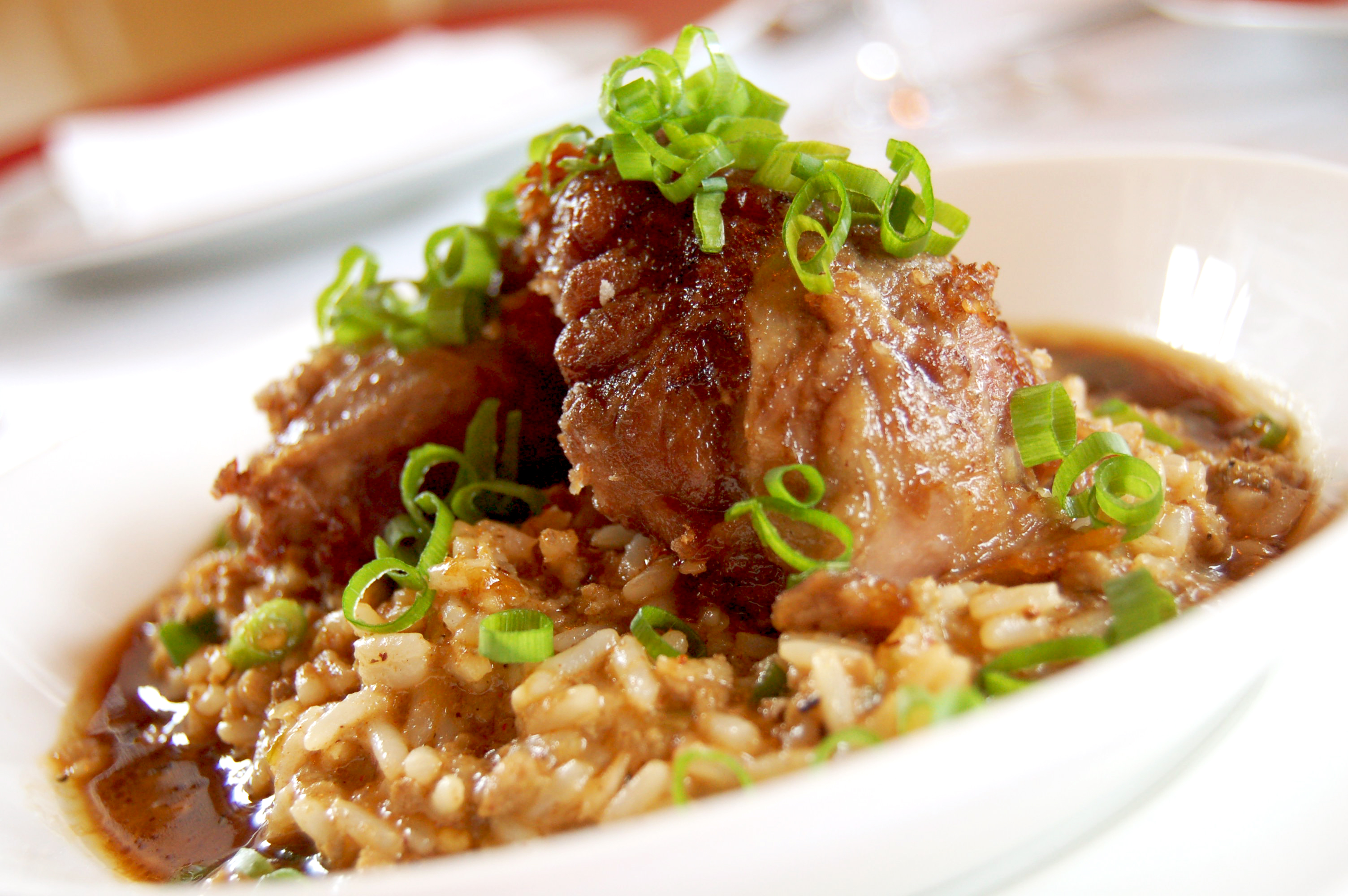 Emeril's Delmonico Crispy Pork Cheeks with Creole Dirty Rice | Emerils.com